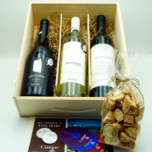 Photo of a wooden case for three wine bottles featuring Cinque's "White Wine Ambassadors" greek wine tasting. 3 of the main Greek Varieties (Santorini’s Assyrtiko, Moschofilero and Malagouzia)